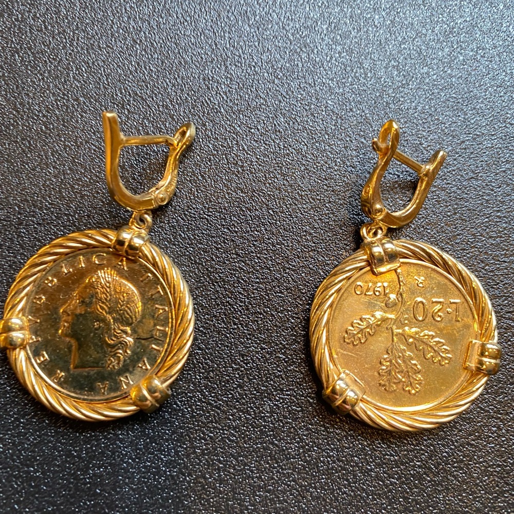 Earrings: coin earrings with gold tone.